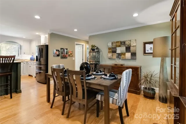 a view of a dining room with furniture and a fireplace