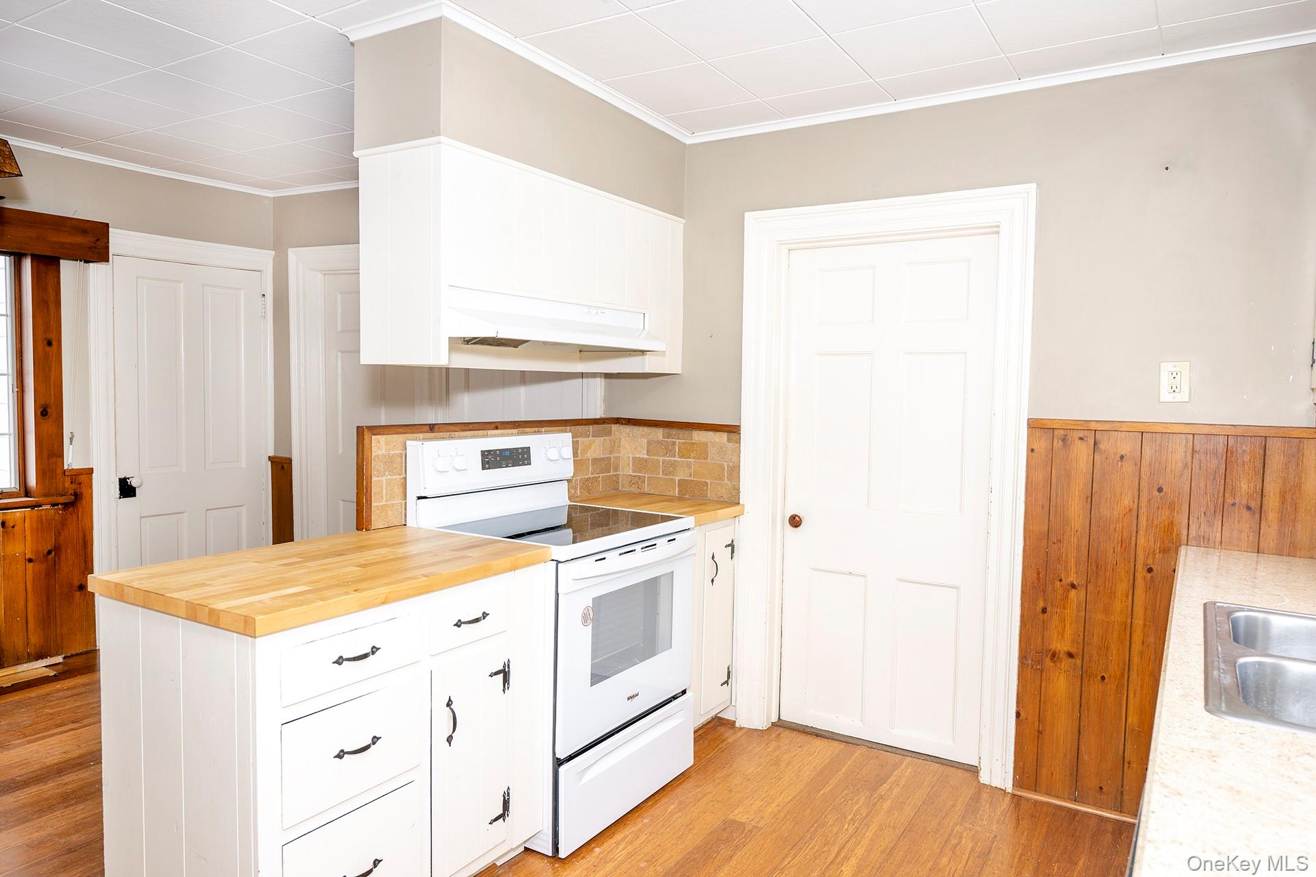 79 Camby Road Millbrook, NY 12545 - Photo 17 of 34 a kitchen with a stove a sink and a refrigerator
