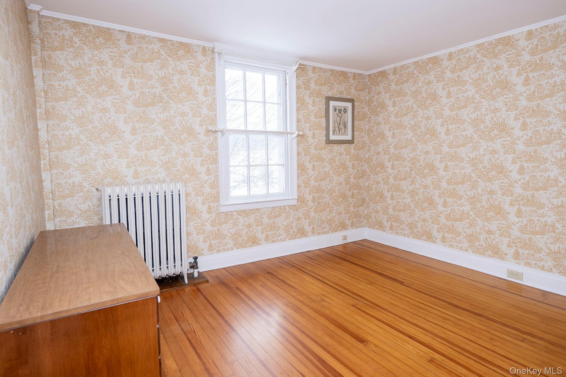 79 Camby Road Millbrook, NY 12545 - Photo 25 of 34 a view of an empty room with wooden floor and a window