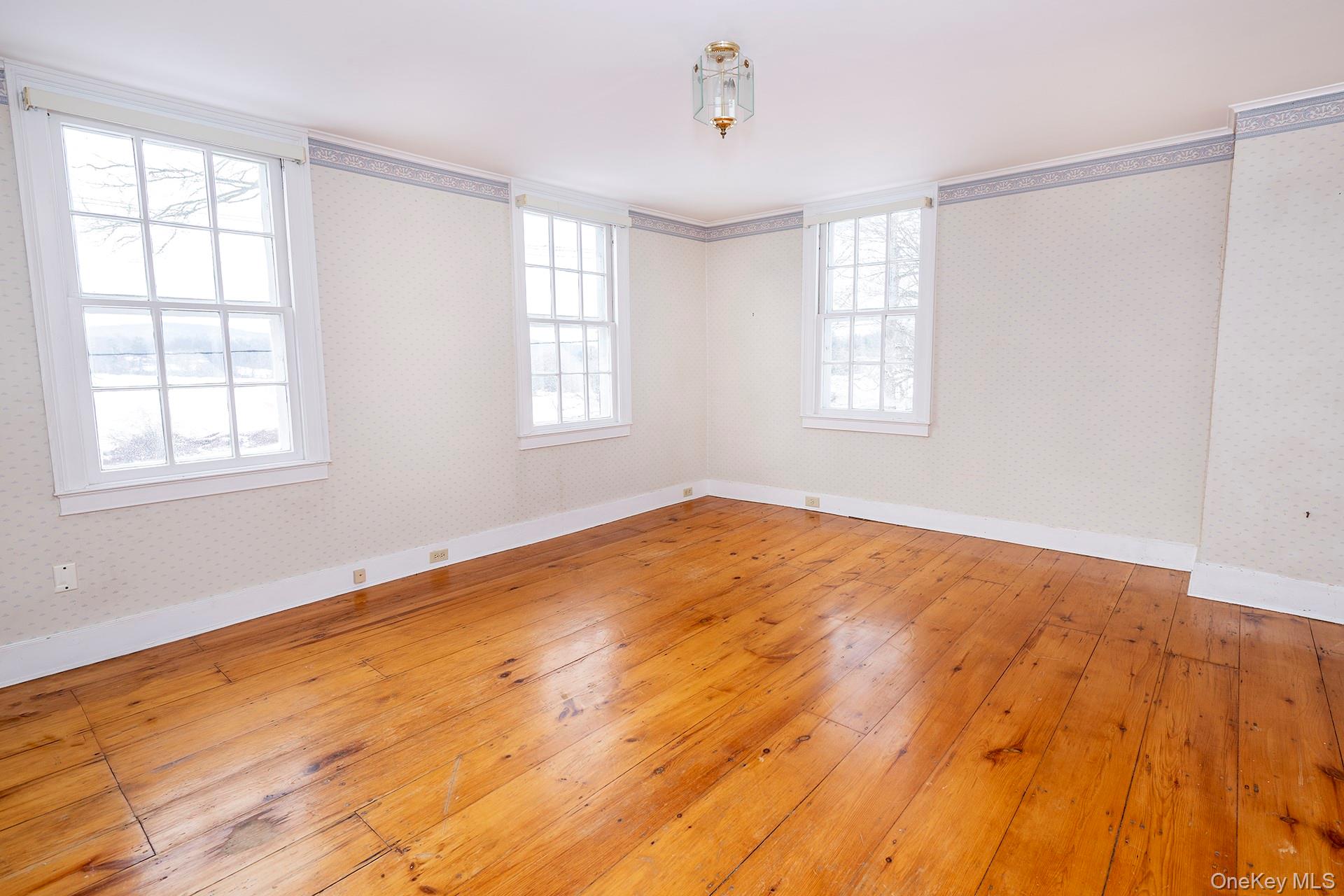 79 Camby Road Millbrook, NY 12545 - Photo 26 of 34 a view of empty room with wooden floor and fan