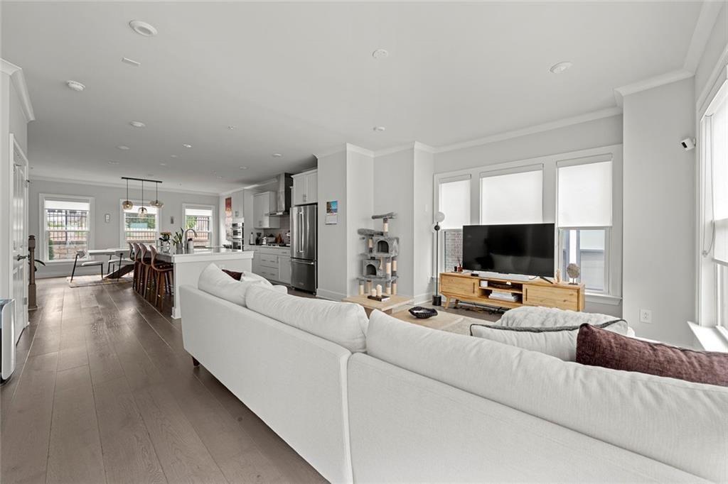 1012 Burnside Ln. Northwest Atlanta, GA 30318 - Photo 12 of 36 a living room with furniture and a flat screen tv