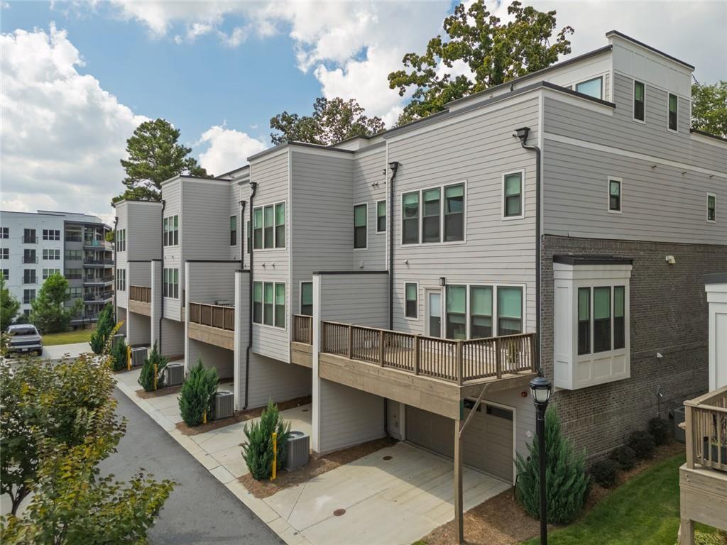 1012 Burnside Ln. Northwest Atlanta, GA 30318 - Photo 2 of 36 a front view of a house with a balcony