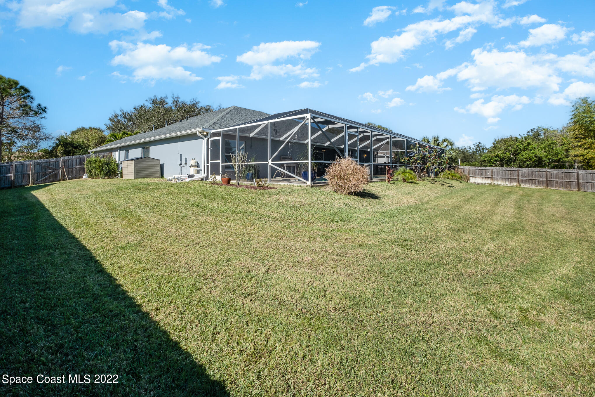 4393 Long Lake Road Melbourne, FL 32934 - Photo 3 of 24 a view of a house with a yard and sitting area