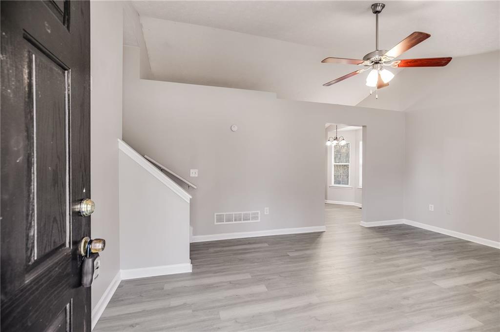 18 Twin Oaks Lane Dallas, GA 30157 - Photo 3 of 24 a view of empty room with wooden floor and fan