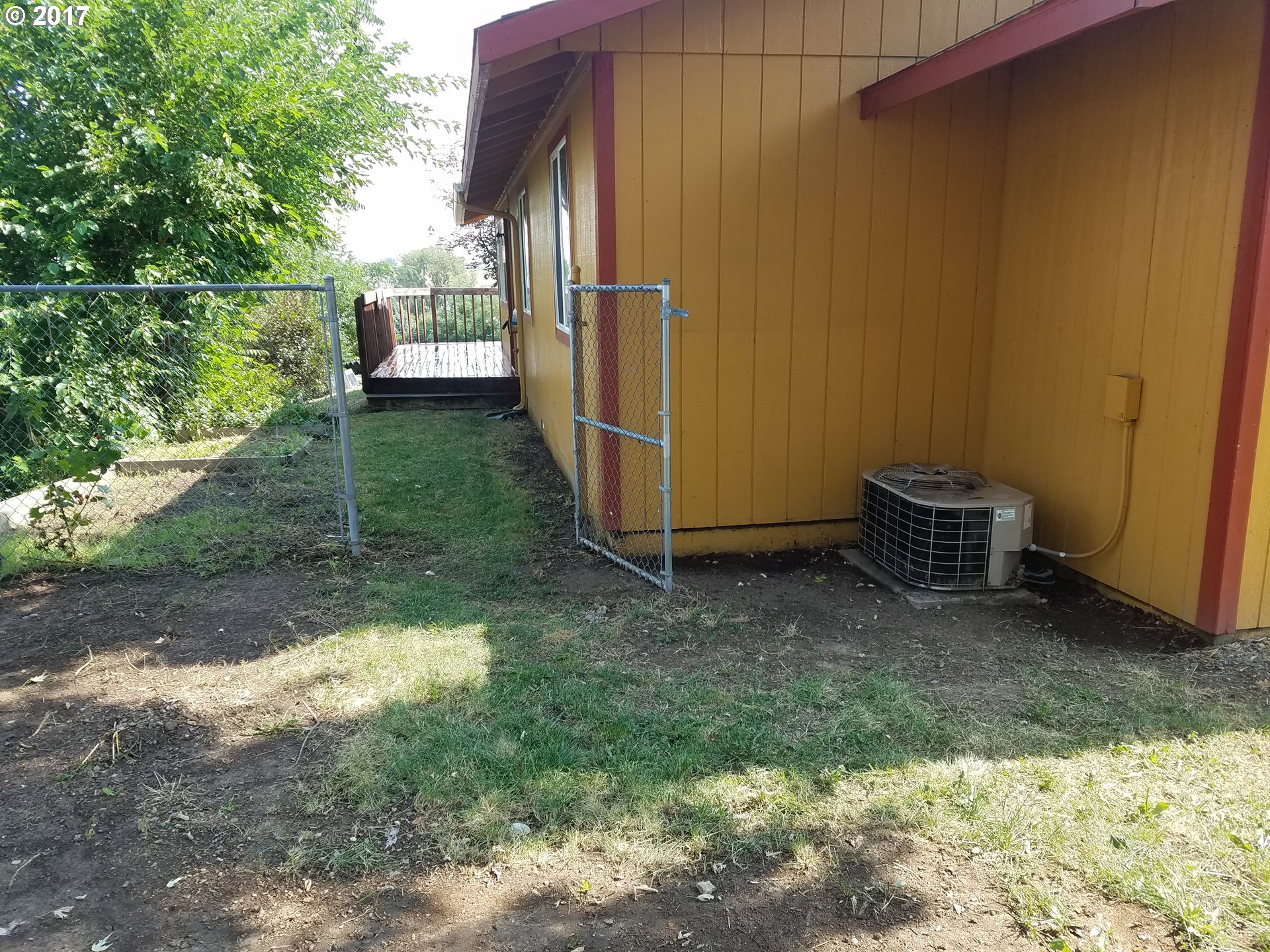 819 Southwest 9th Street Pendleton, OR 97801 - Photo 18 of 20 a backyard of a house with table and chairs