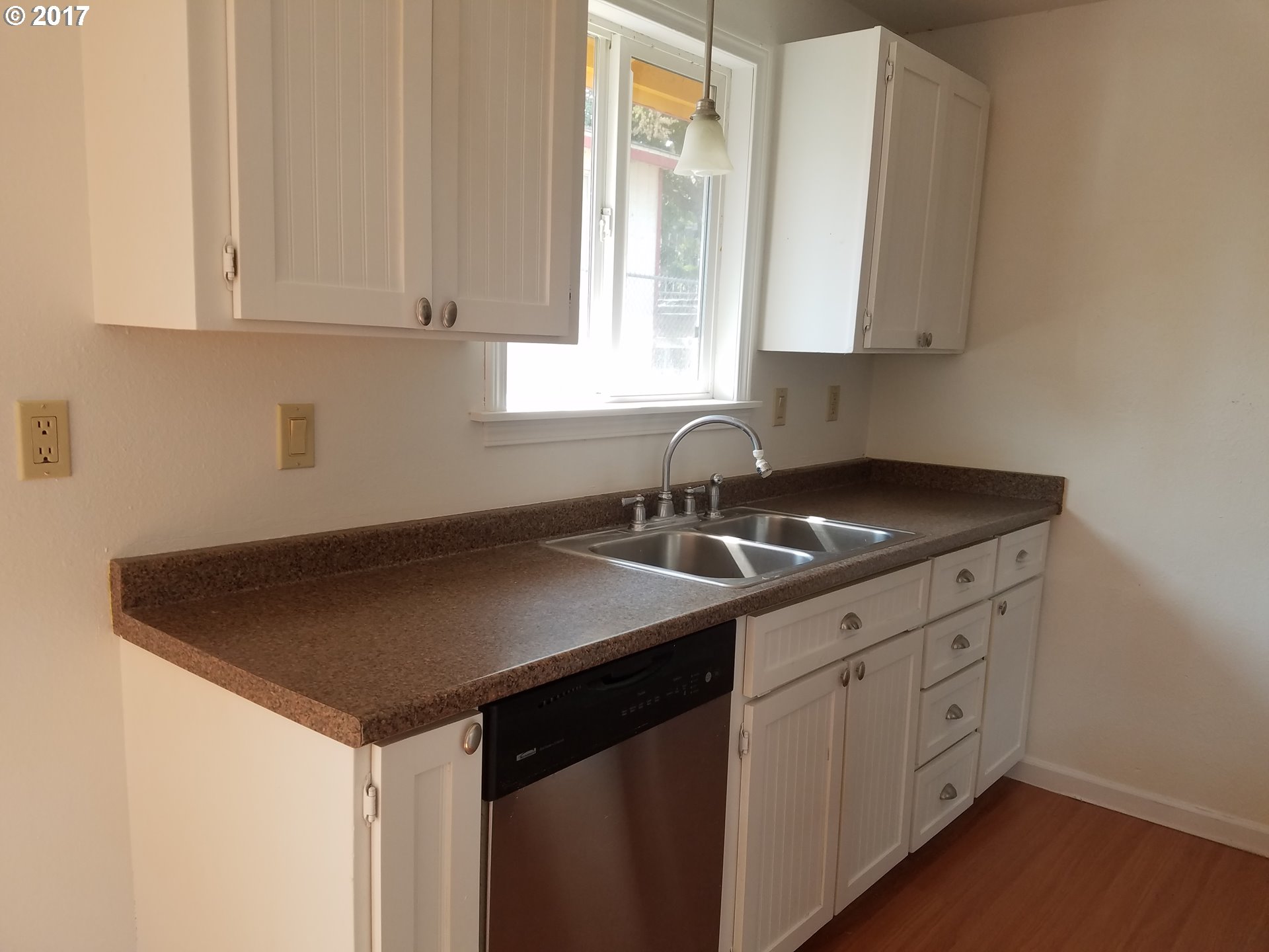 819 Southwest 9th Street Pendleton, OR 97801 - Photo 3 of 20 a kitchen with a sink cabinets and a window