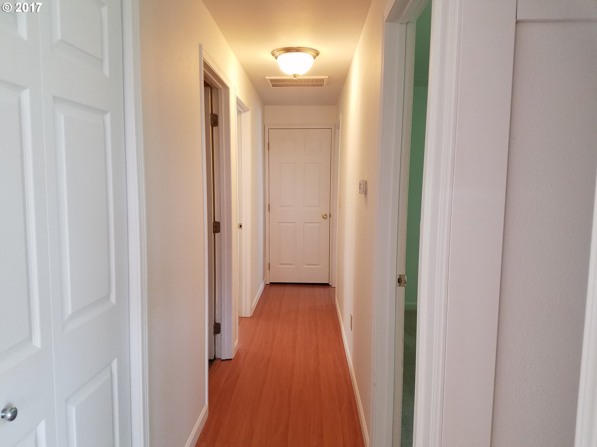 819 Southwest 9th Street Pendleton, OR 97801 - Photo 7 of 20 a view of a hallway with wooden floor