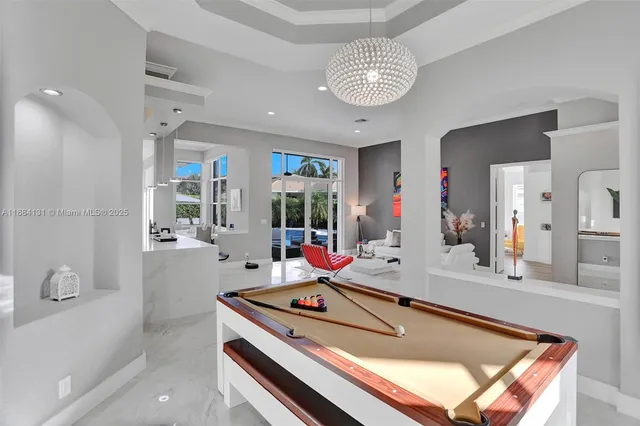 a kitchen that has a refrigerator and a stove top oven