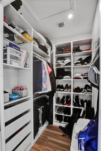 a bedroom with a bed and glass window