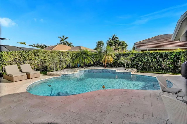 an aerial view of a house with a garden