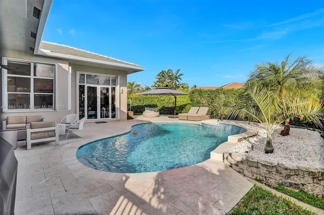 a view of outdoor space with swimming pool