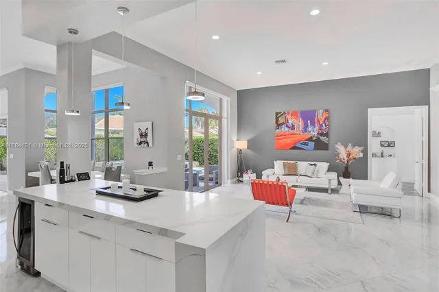 a living room with dining room and furniture