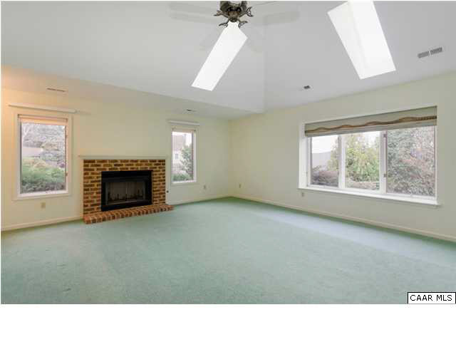 4830 Mechums River Road Charlottesville, VA 22901 - Photo 4 of 17 Bright and airy, this living room features a vaulted ceiling and skylights.,Bright and airy, this living room features a vaulted ceiling and skylights.