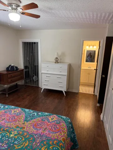 a view of an empty room and wooden floor