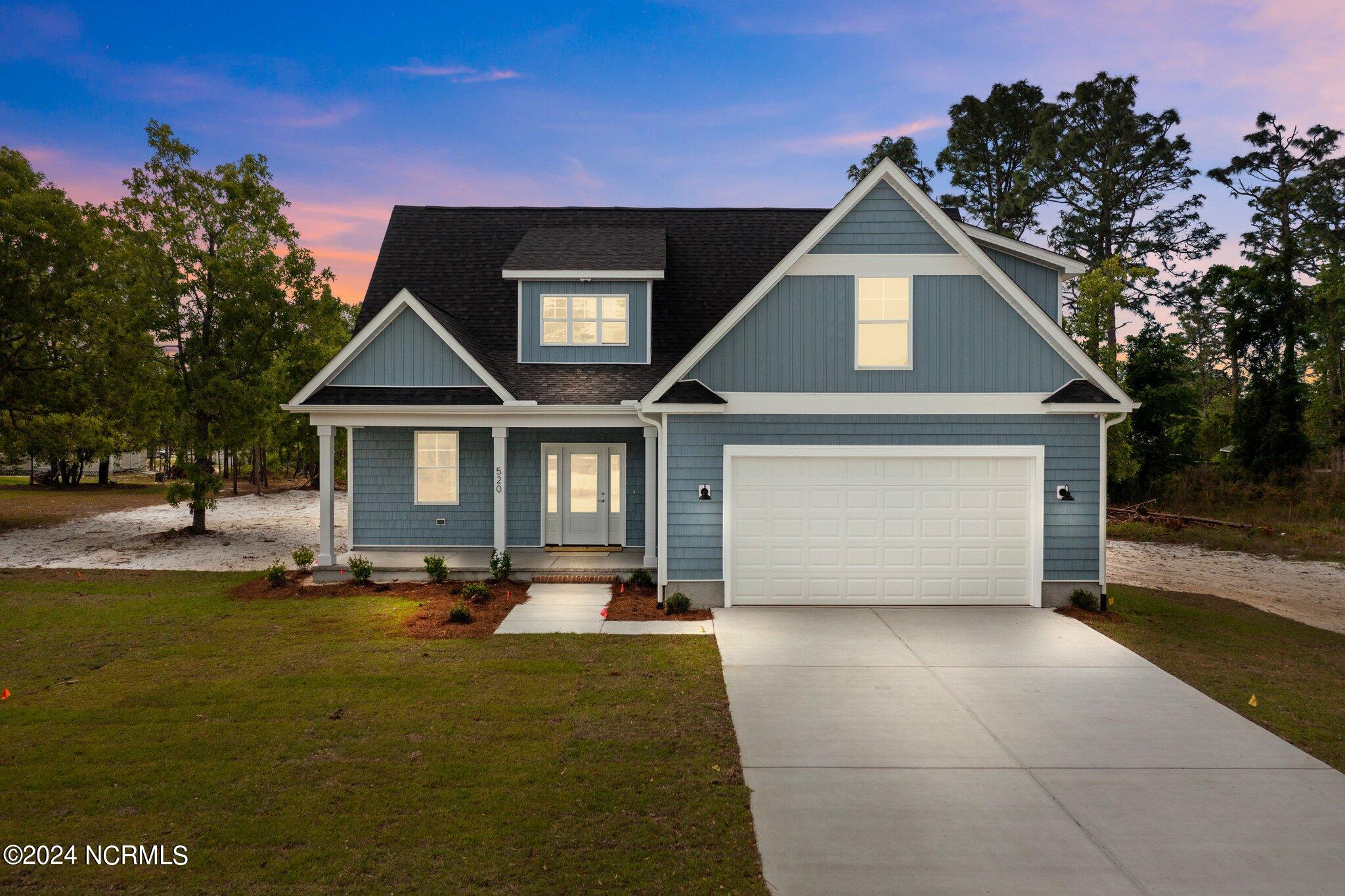 520 Barber Road Southport, NC 28461 - Photo 2 of 34 Large Private lot with hardwood trees. Covered front and back porches on culdesac