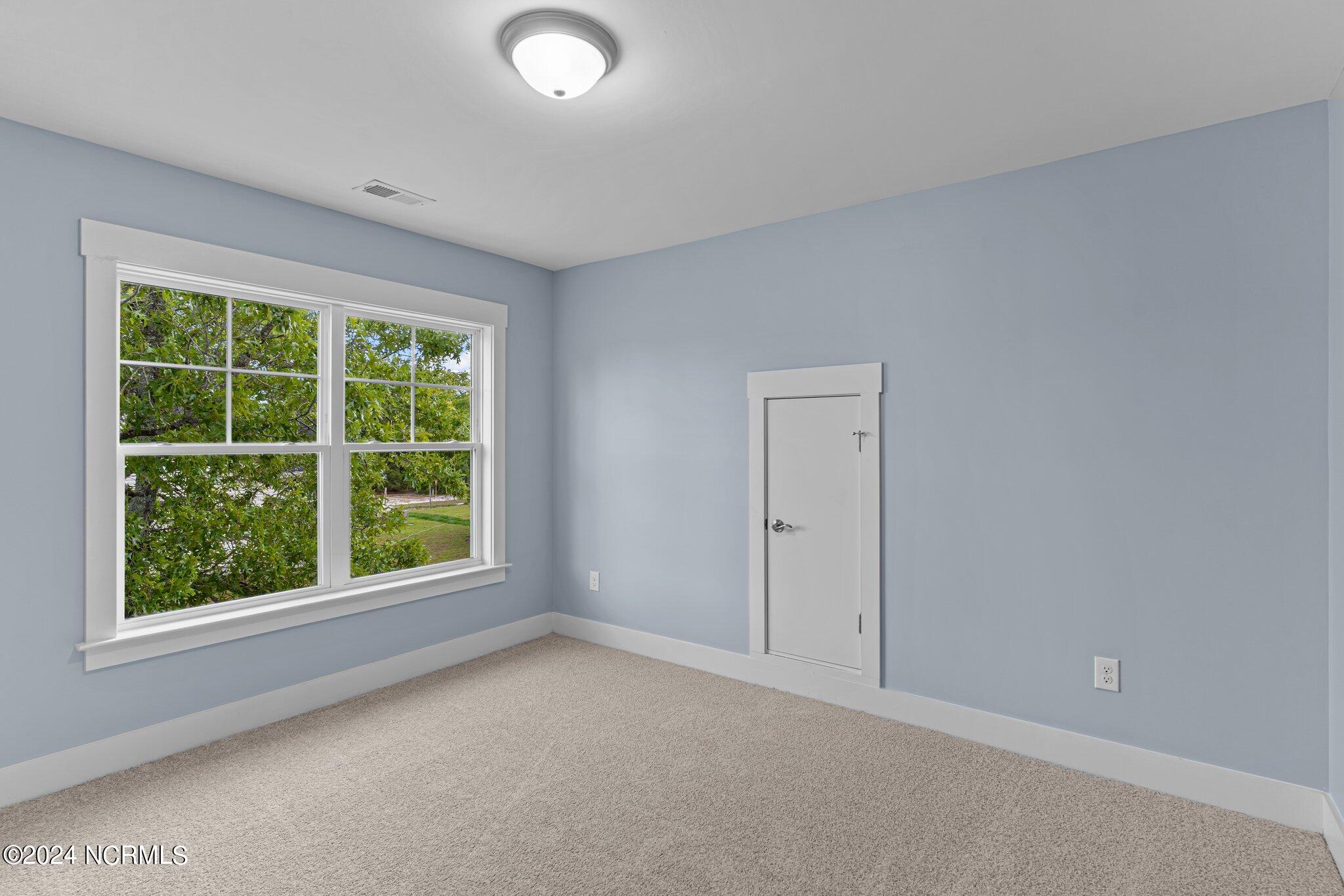 520 Barber Road Southport, NC 28461 - Photo 32 of 34 Bed 2 and 3 with eaves storage