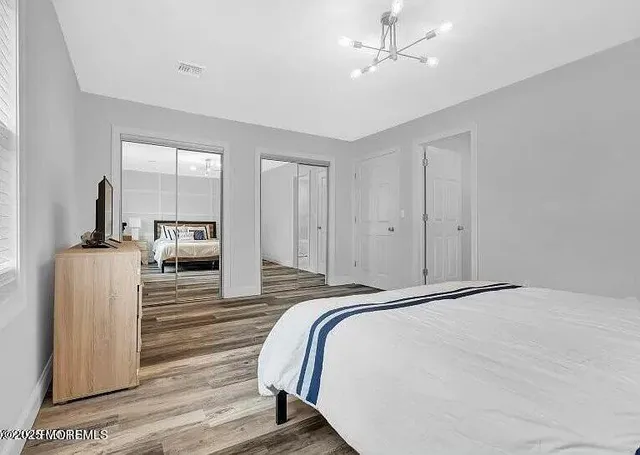 a bedroom with a bed and a view of en suite