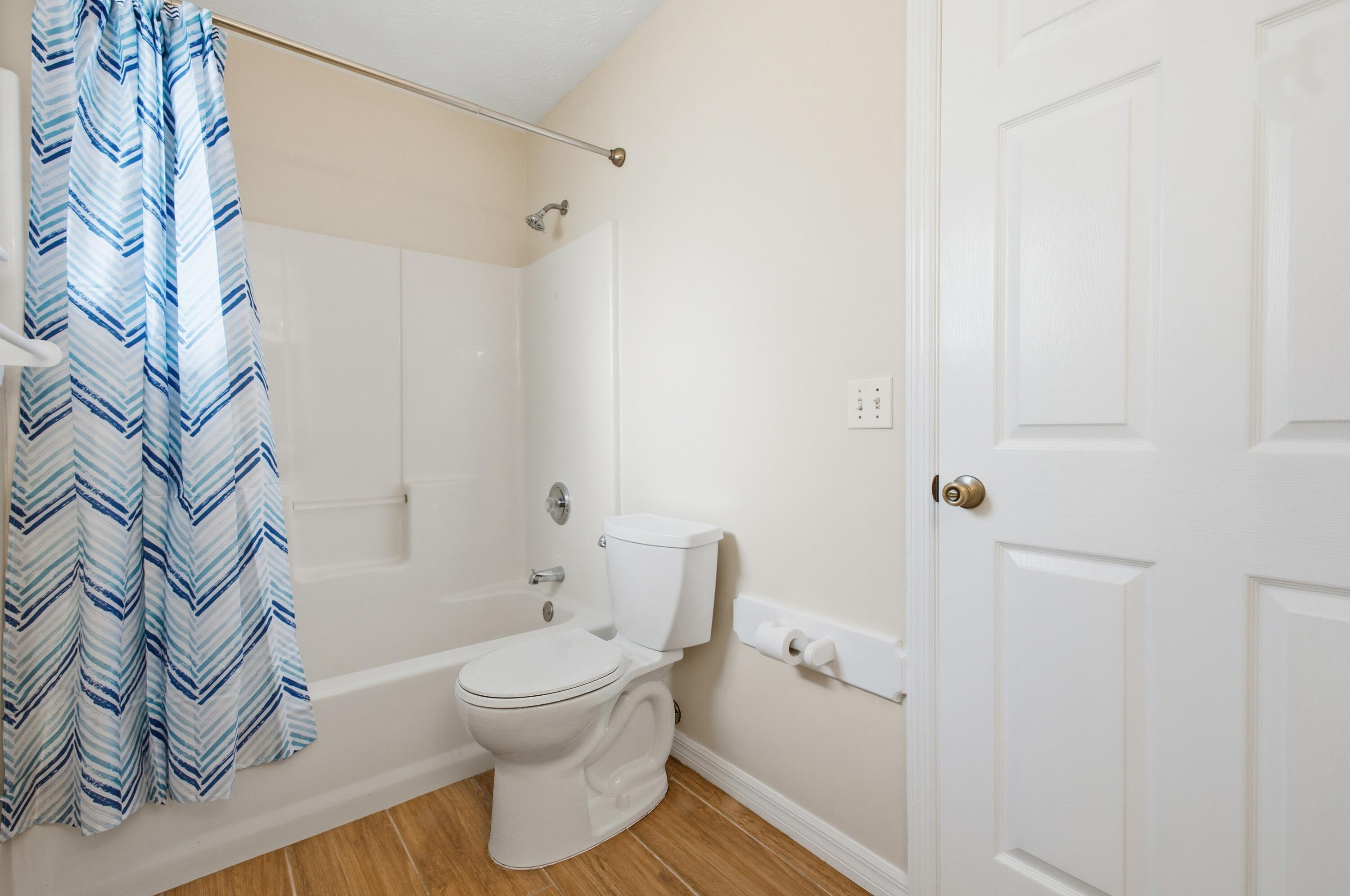 5809 Killarney Avenue Fort Pierce, FL 34951 - Photo 15 of 29 a bathroom with a toilet and a shower