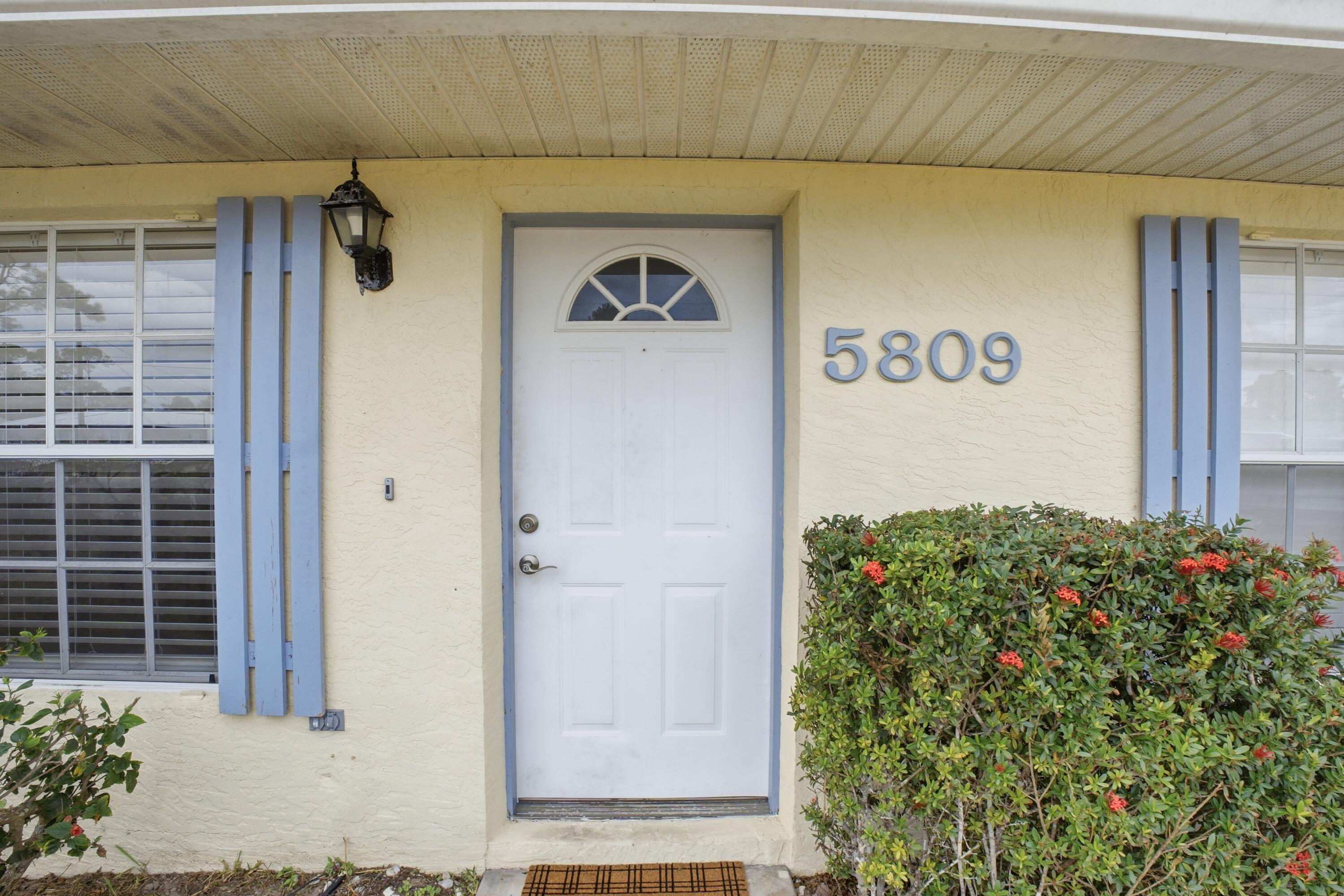 5809 Killarney Avenue Fort Pierce, FL 34951 - Photo 2 of 29 a front view of a house