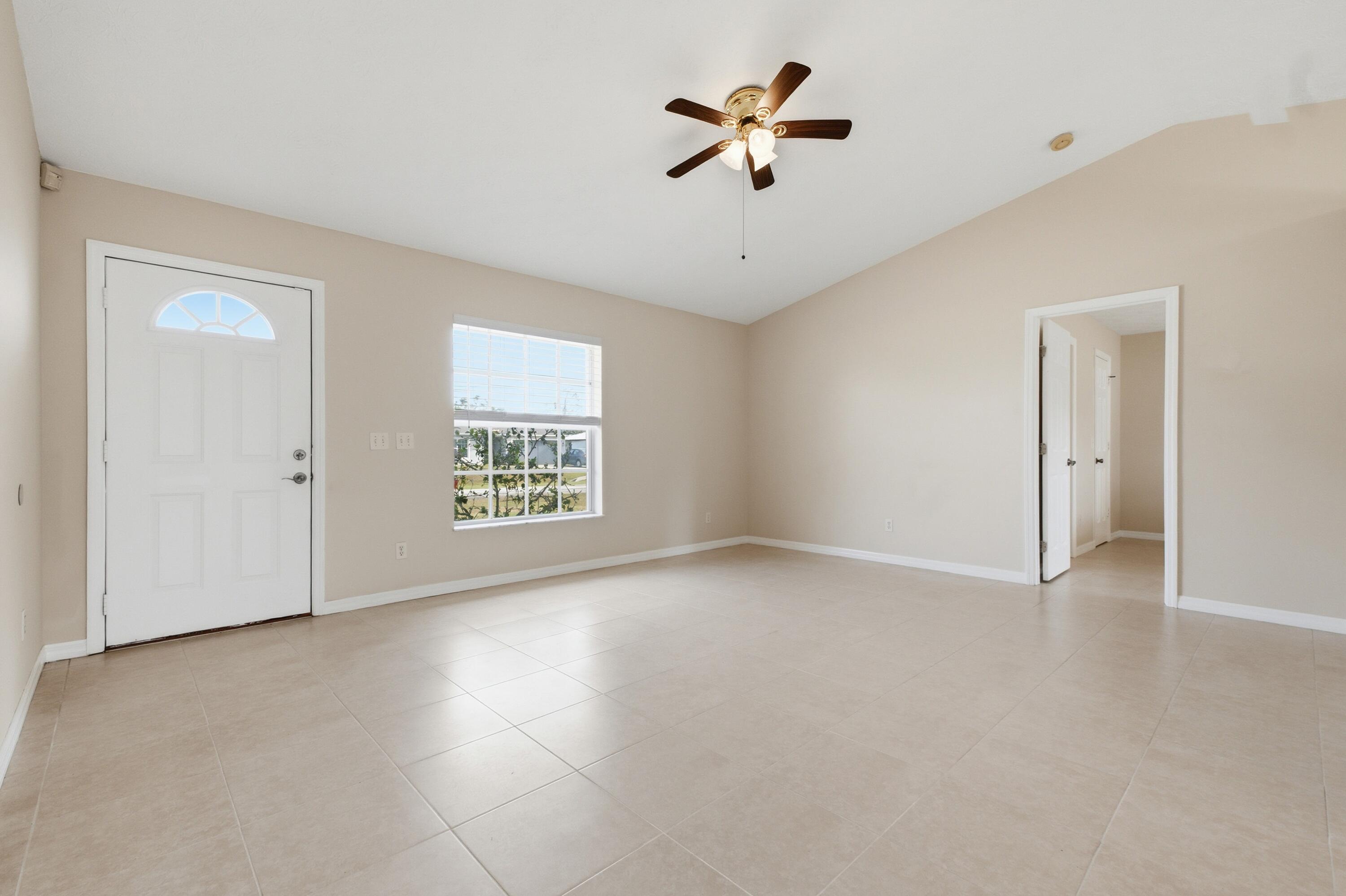 5809 Killarney Avenue Fort Pierce, FL 34951 - Photo 3 of 29 a view of an empty room with a window