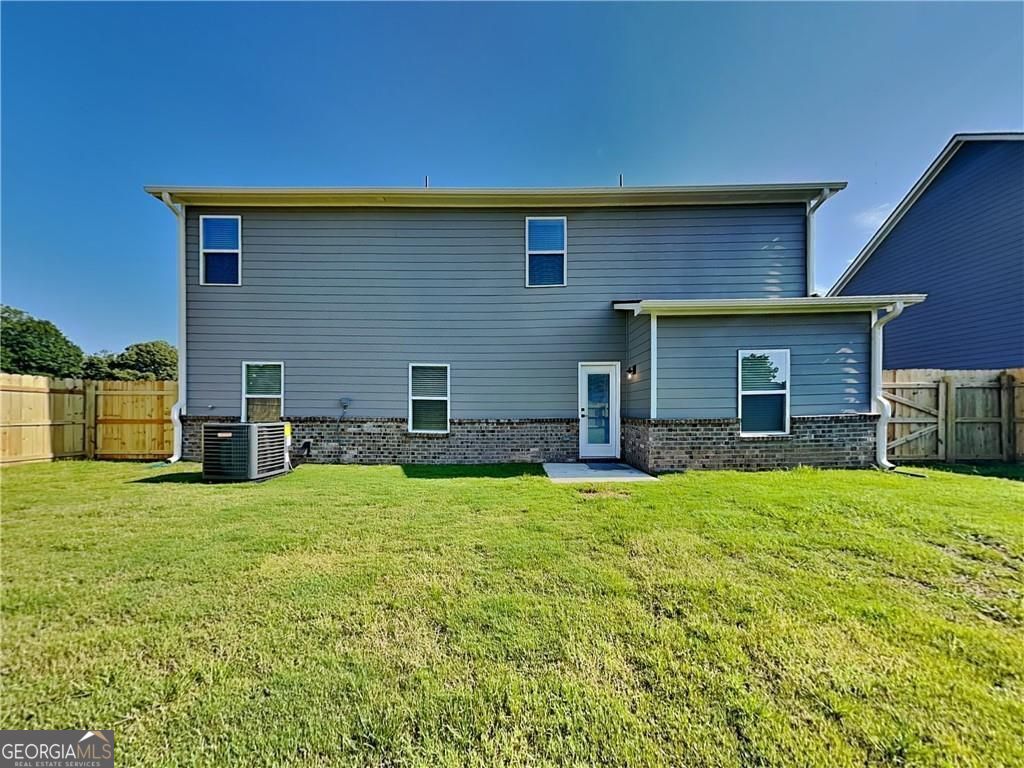 3323 Arabian Farm Lane Dacula, GA 30019 - Photo 17 of 24 a house view with a garden space