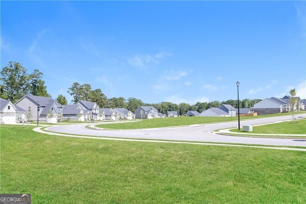 3323 Arabian Farm Lane Dacula, GA 30019 - Photo 22 of 24 a view of a house with a big yard