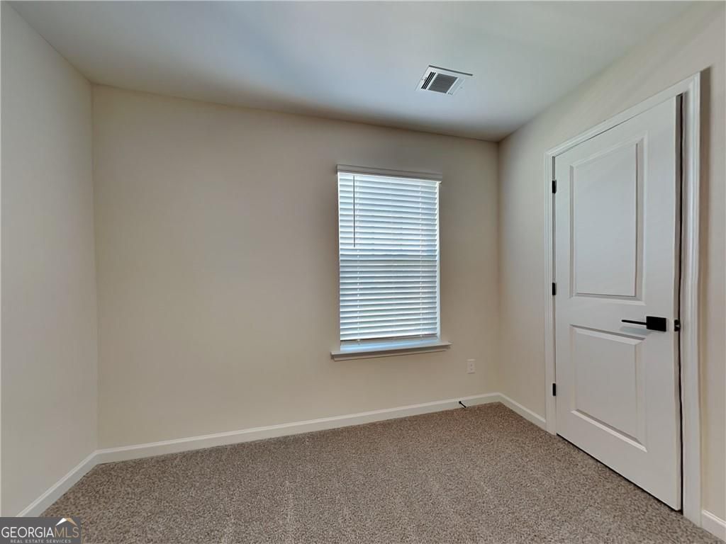 3323 Arabian Farm Lane Dacula, GA 30019 - Photo 5 of 24 a view of an empty room with a window