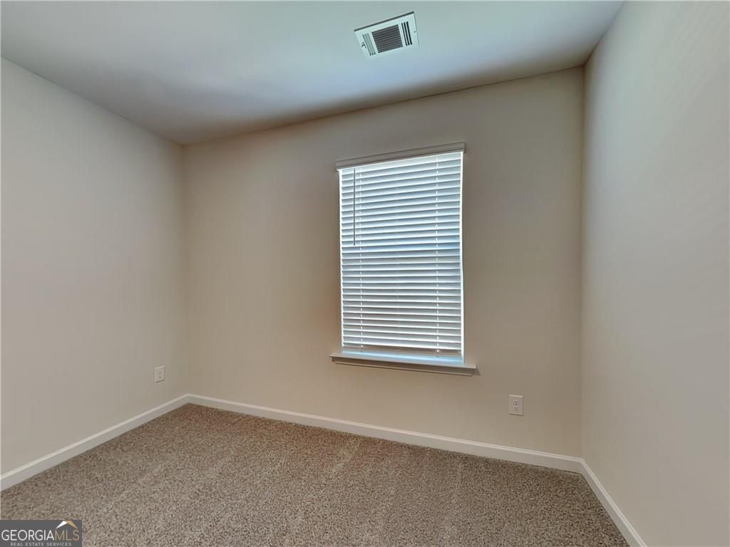 3323 Arabian Farm Lane Dacula, GA 30019 - Photo 10 of 24 an empty room with a window