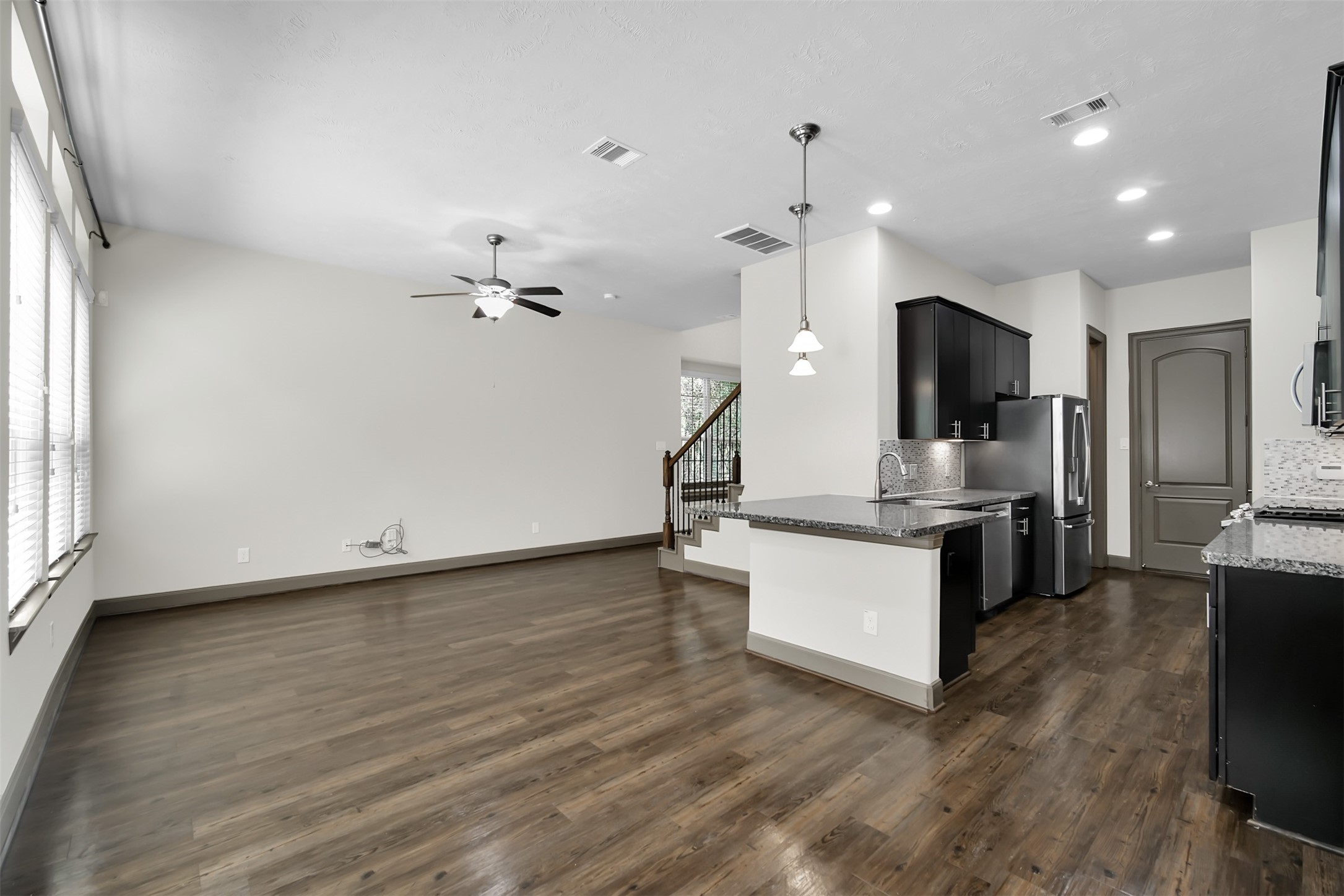 111 Aventura Place Spring, TX 77389 - Photo 12 of 42 a view of kitchen with sink microwave and refrigerator