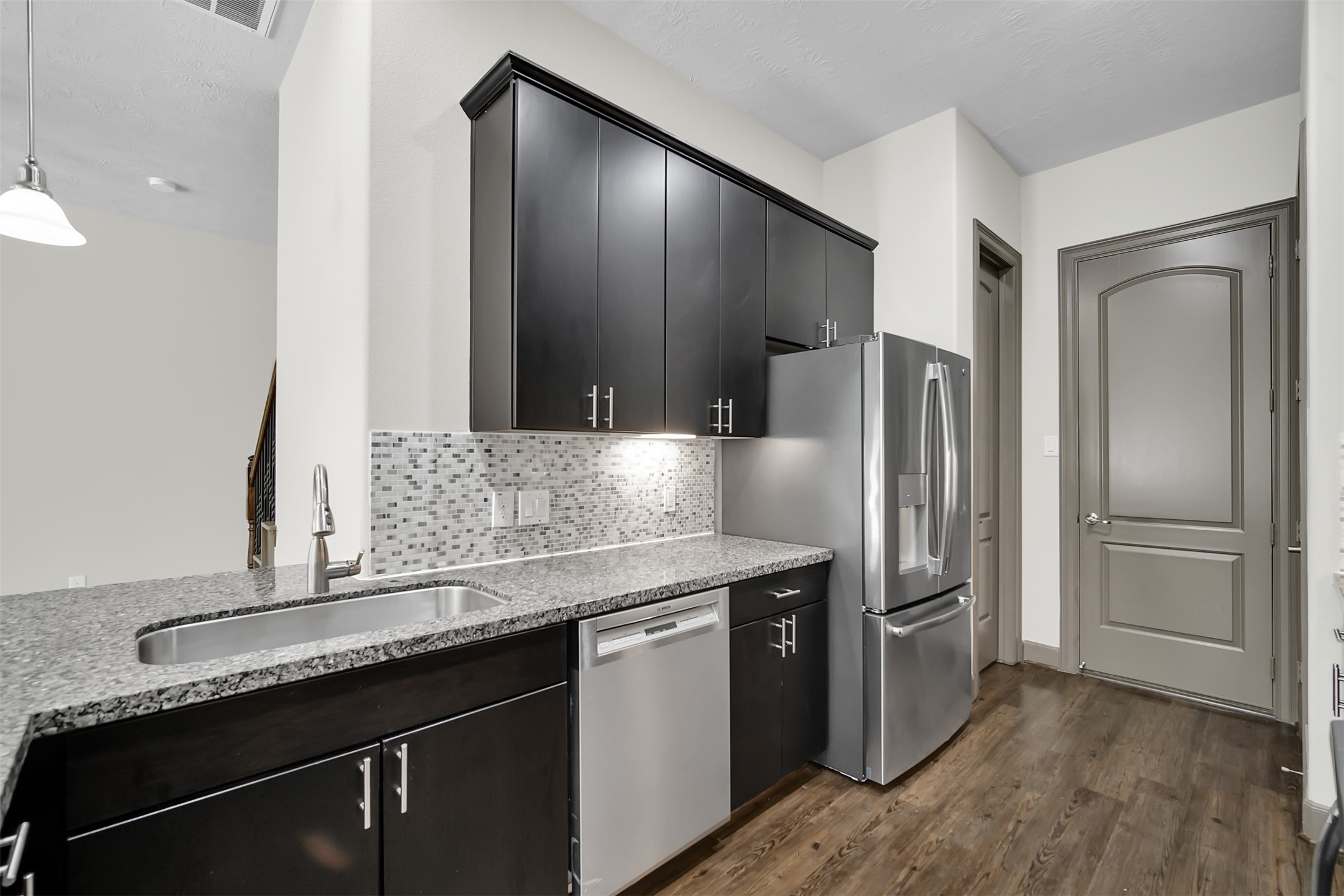 111 Aventura Place Spring, TX 77389 - Photo 14 of 42 a kitchen with stainless steel appliances granite countertop a refrigerator and a sink