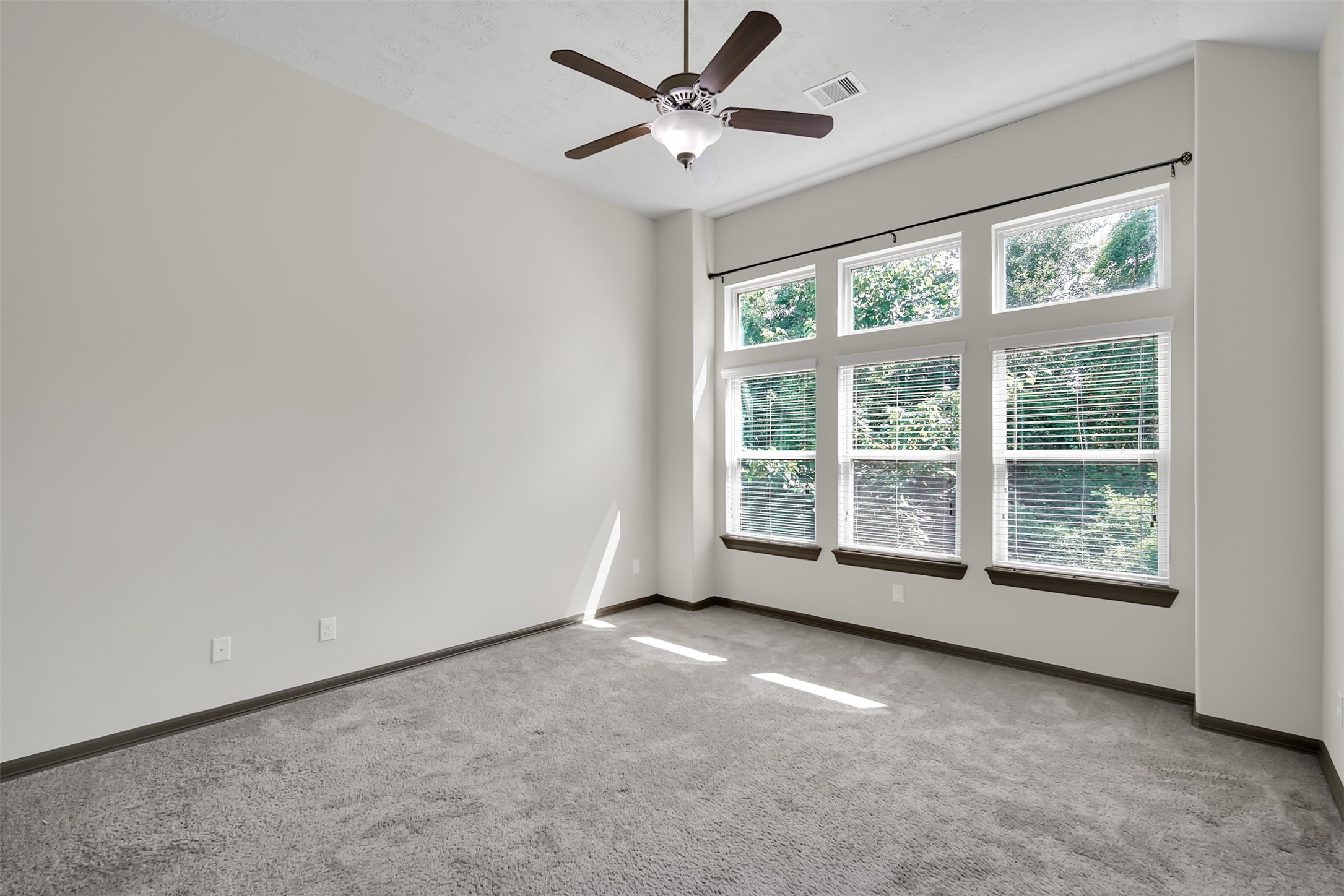 111 Aventura Place Spring, TX 77389 - Photo 20 of 42 an empty room with a window and a fan