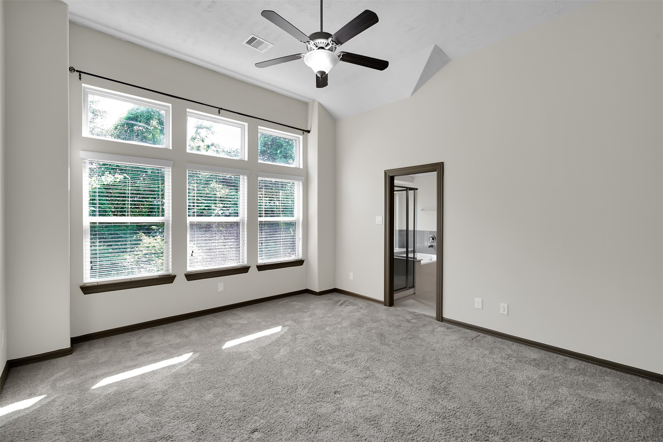 111 Aventura Place Spring, TX 77389 - Photo 21 of 42 an empty room with chandelier fan and windows