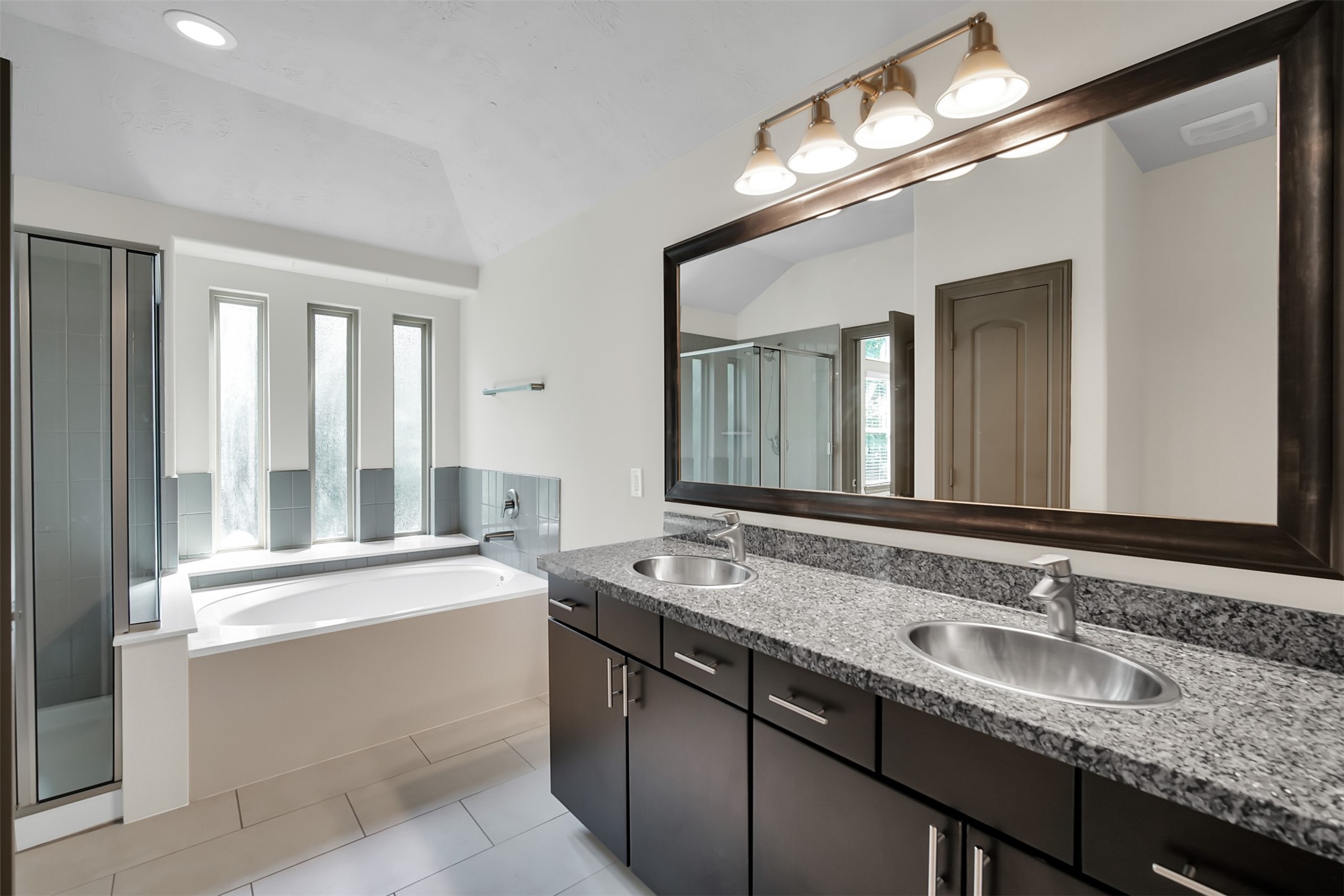 111 Aventura Place Spring, TX 77389 - Photo 24 of 42 a bathroom with a sink double vanity and a mirror