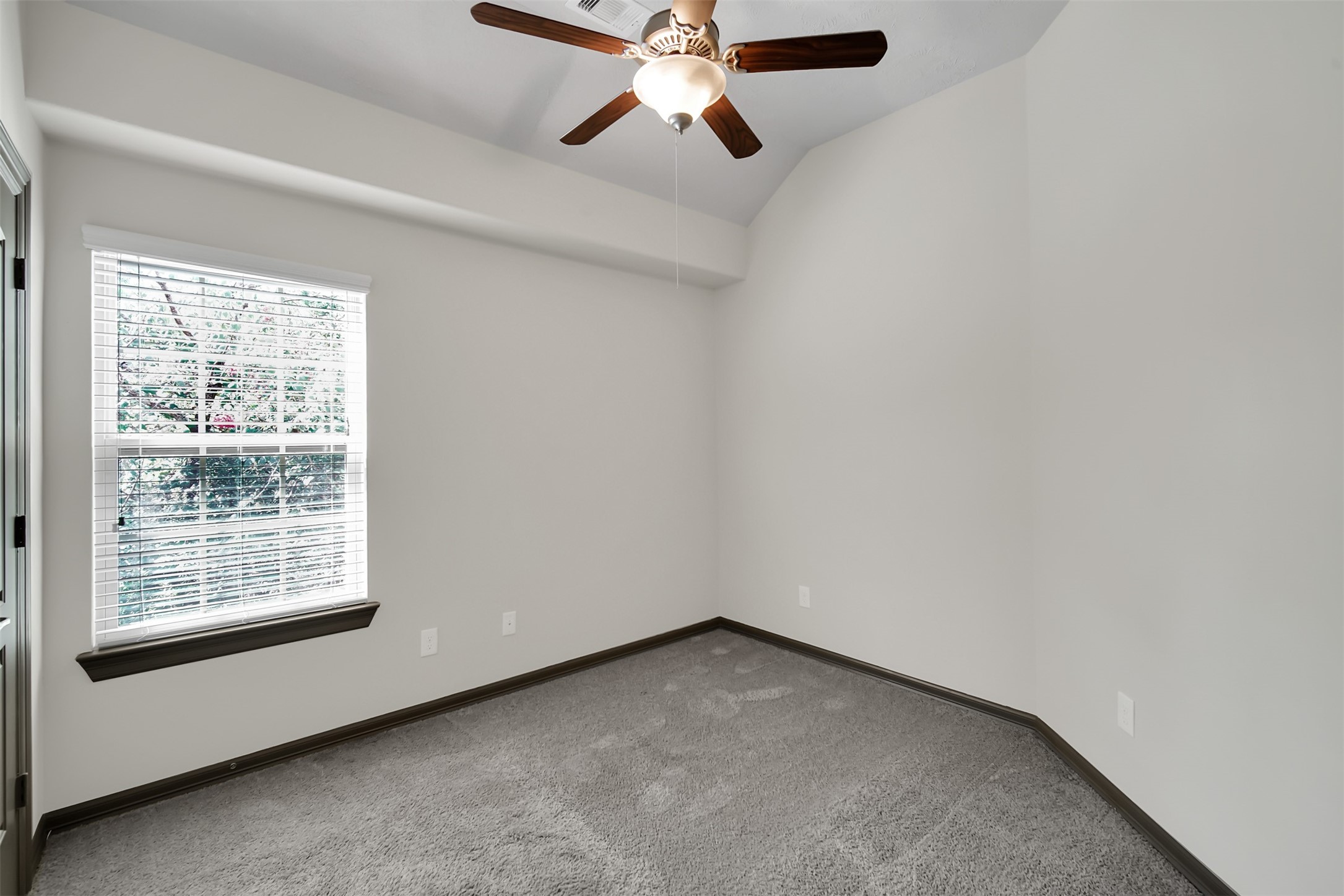 111 Aventura Place Spring, TX 77389 - Photo 26 of 42 an empty room with a window and a fan