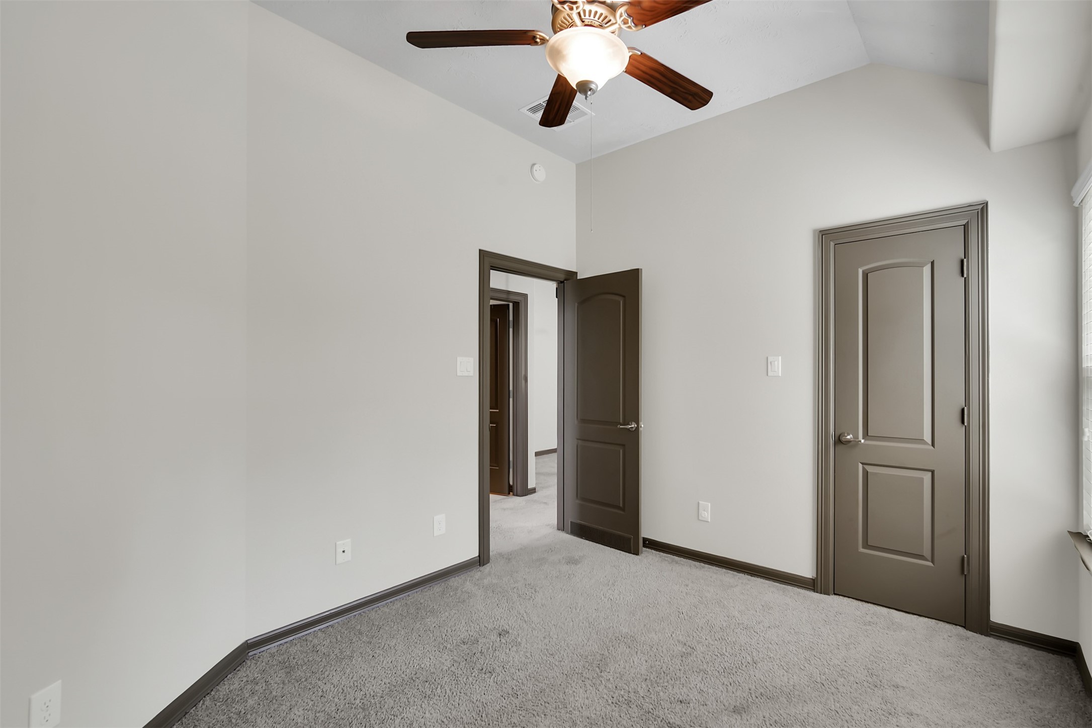 111 Aventura Place Spring, TX 77389 - Photo 27 of 42 an empty room with closet and a chandelier fan