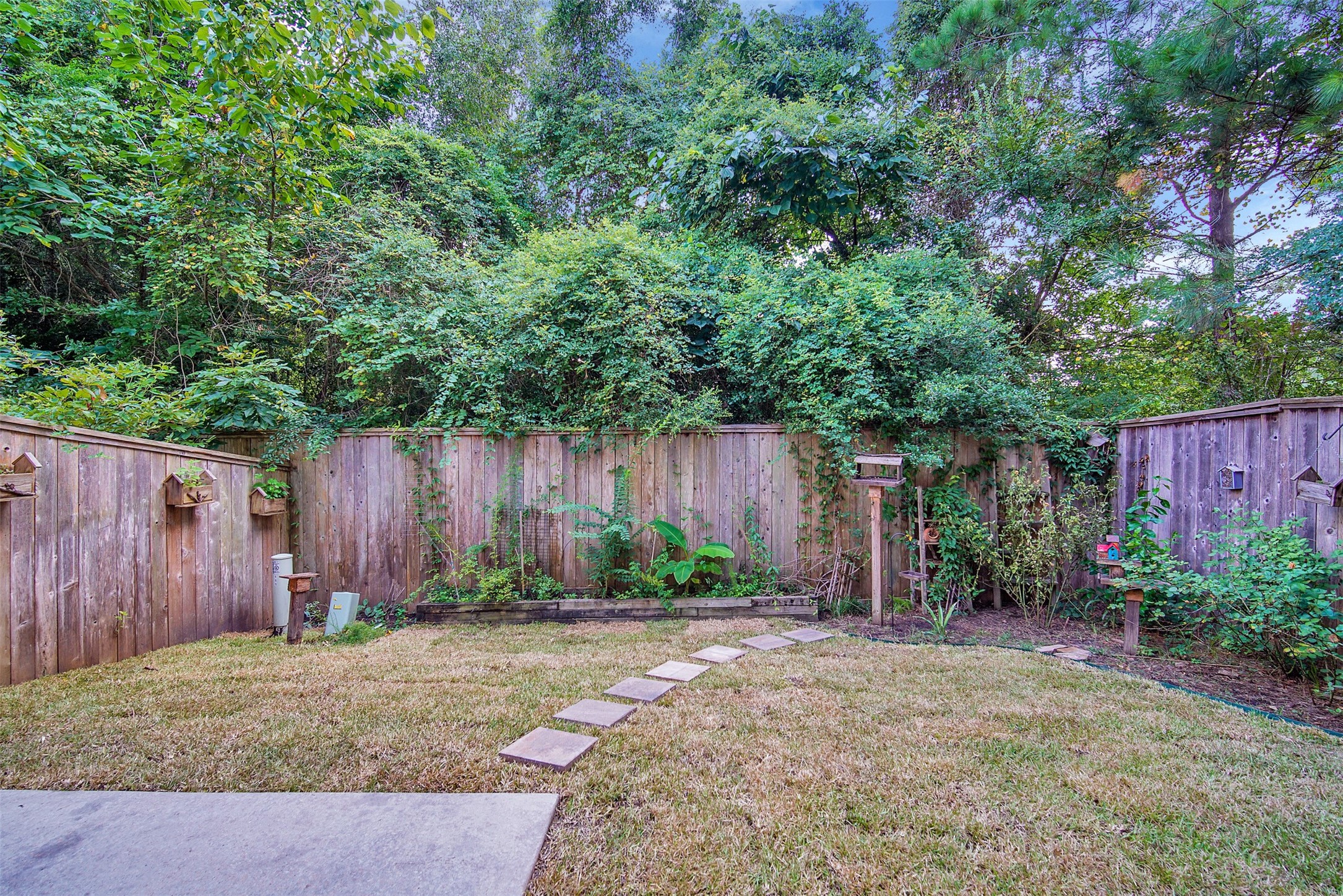 111 Aventura Place Spring, TX 77389 - Photo 34 of 42 a backyard of a house with lots of green space