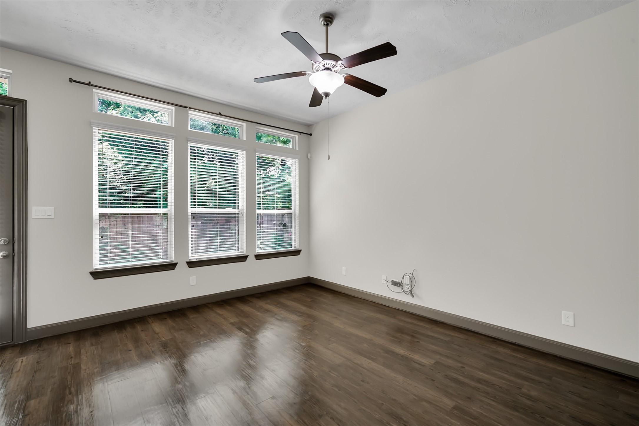 111 Aventura Place Spring, TX 77389 - Photo 8 of 42 a view of wooden floor and a chandelier fan in a room