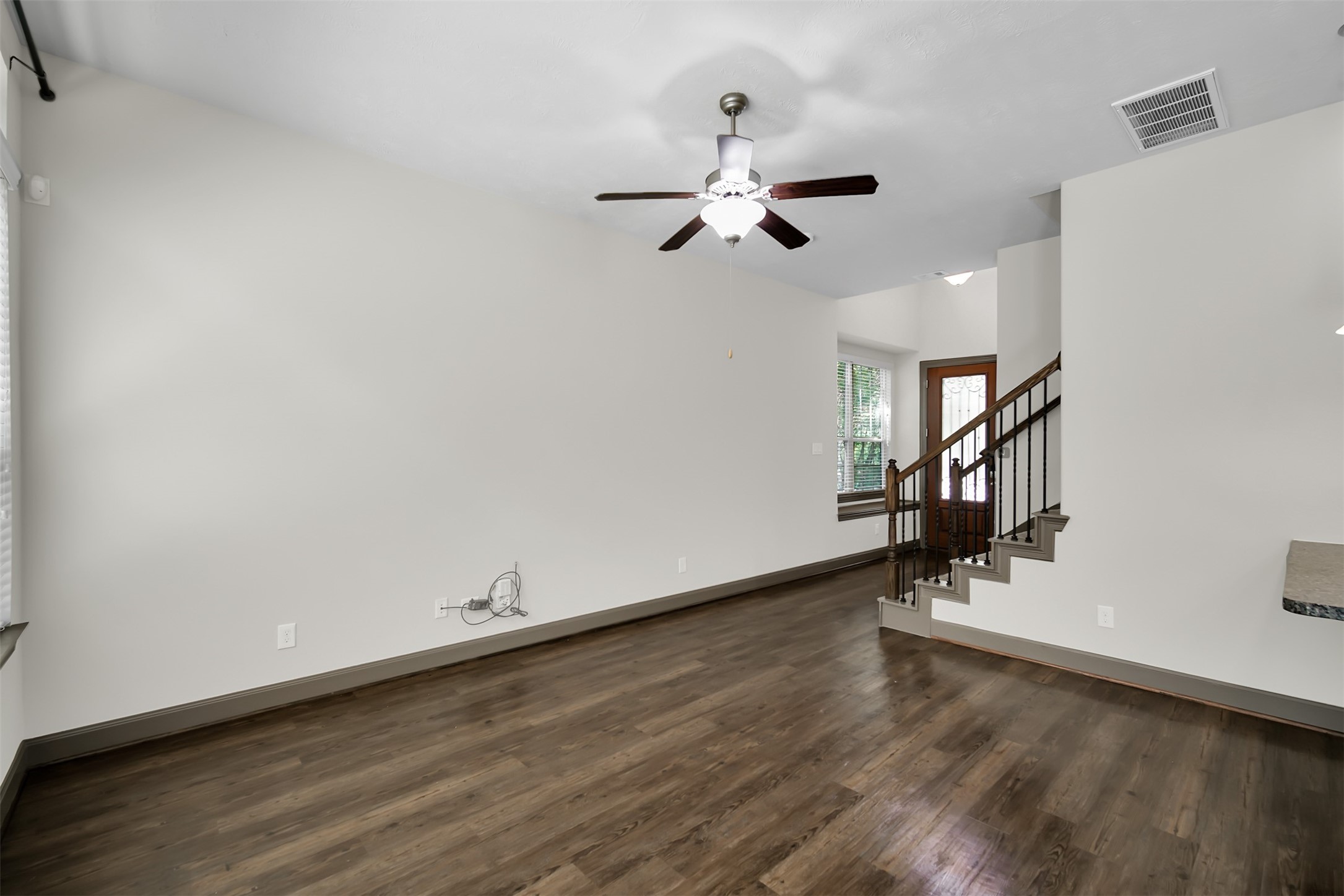 111 Aventura Place Spring, TX 77389 - Photo 9 of 42 a view of room with hardwood floor and a ceiling fan
