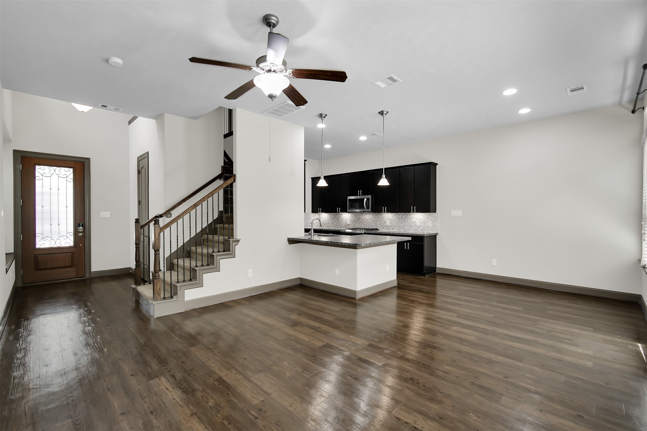 111 Aventura Place Spring, TX 77389 - Photo 10 of 42 a view of kitchen and kitchen with stainless steel appliances