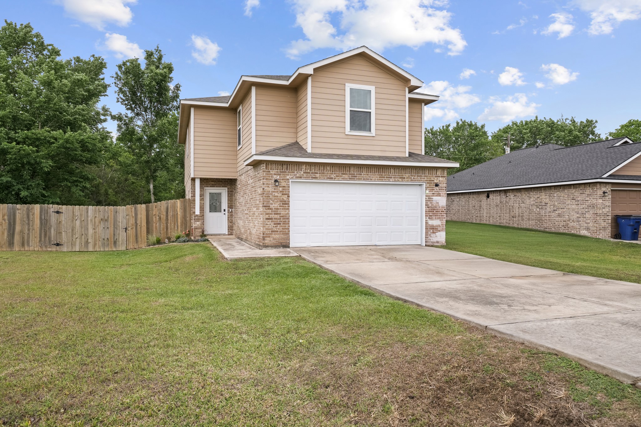 6101 Fox Ridge Drive Angleton, TX 77515 - Photo 1 of 30 a front view of house with yard and garage