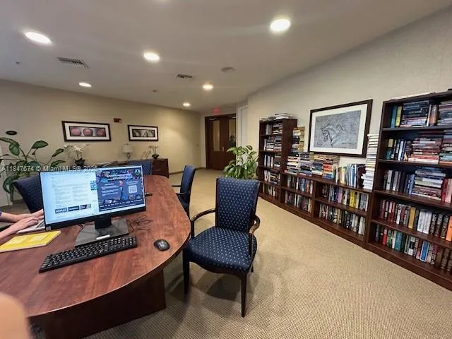 a bathroom with a glass door shower and a sink