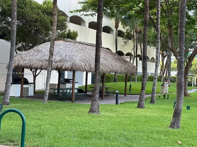 a view of a house with a backyard porch and sitting area