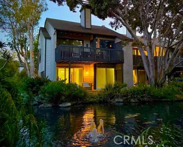 a view of a lake with a house in the background
