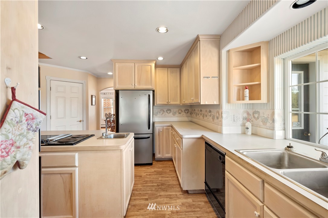 165 Conradi Road Winlock, WA 98596 - Photo 13 of 40 a kitchen that has a sink cabinets counter space and appliances