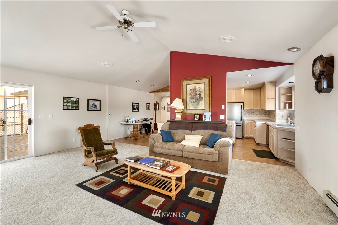 165 Conradi Road Winlock, WA 98596 - Photo 18 of 40 a living room with furniture a rug and a window