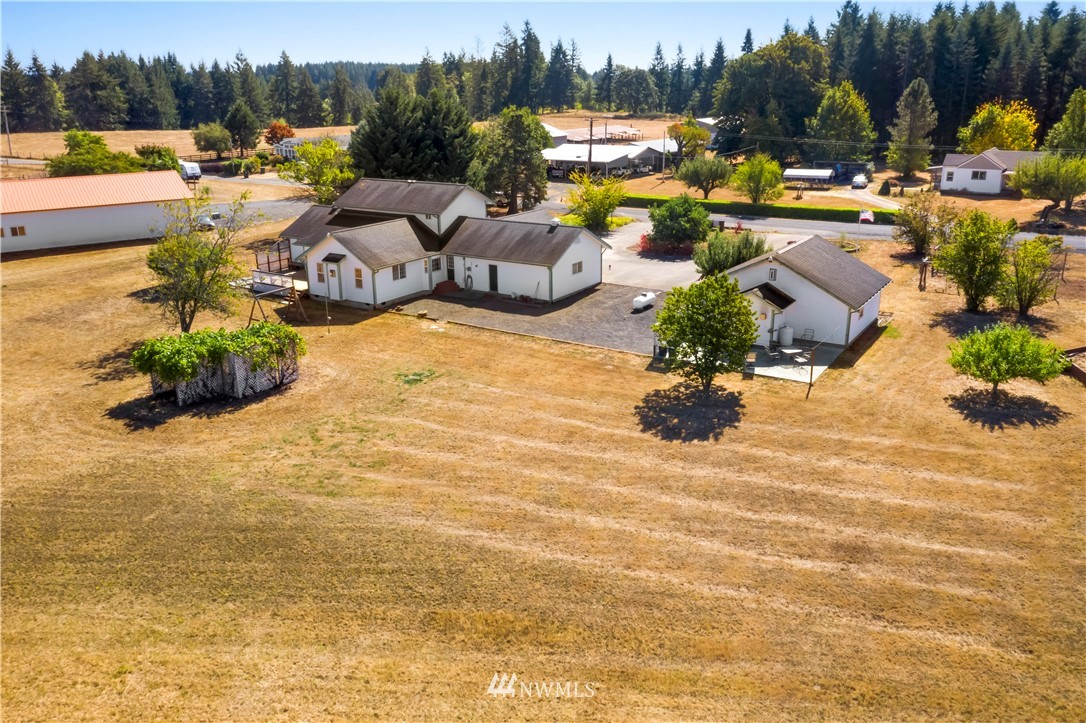 165 Conradi Road Winlock, WA 98596 - Photo 39 of 40 a view of a lake with lawn chairs