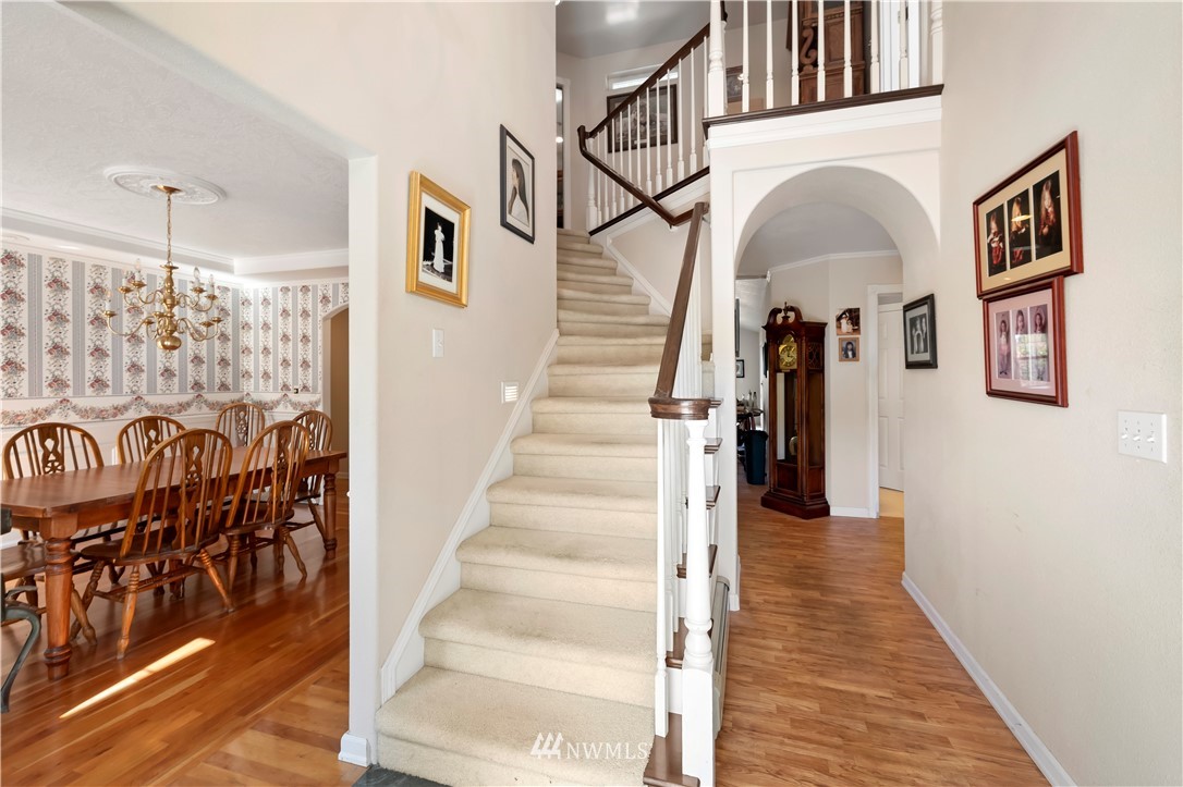165 Conradi Road Winlock, WA 98596 - Photo 5 of 40 a view of staircase with lots of frames on wall and a window