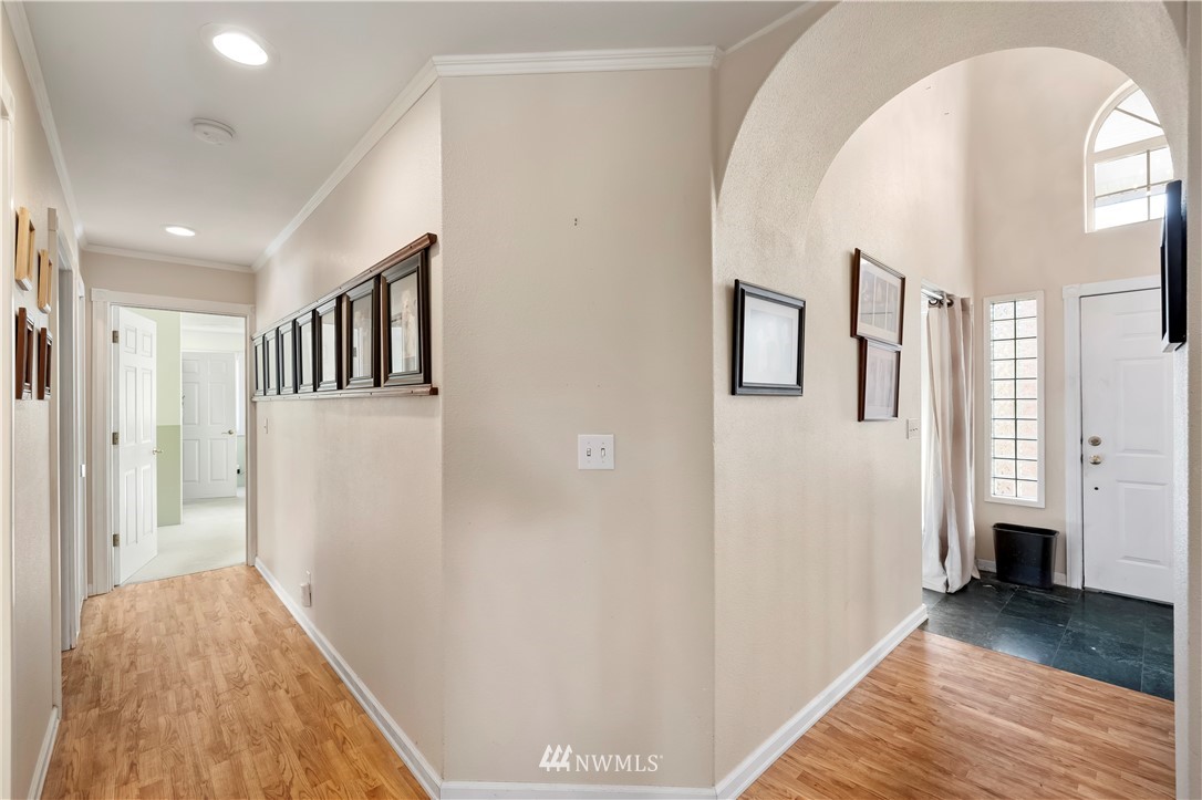165 Conradi Road Winlock, WA 98596 - Photo 7 of 40 a view of a hallway with wooden floor and a living room