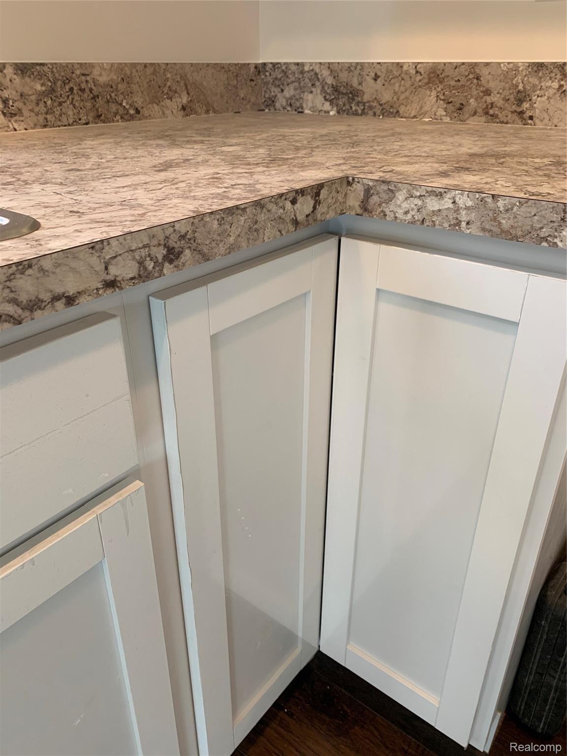 5372 Rural Terrace Waterford, MI 48329 - Photo 25 of 55 White cabinet dark counter.jpeg