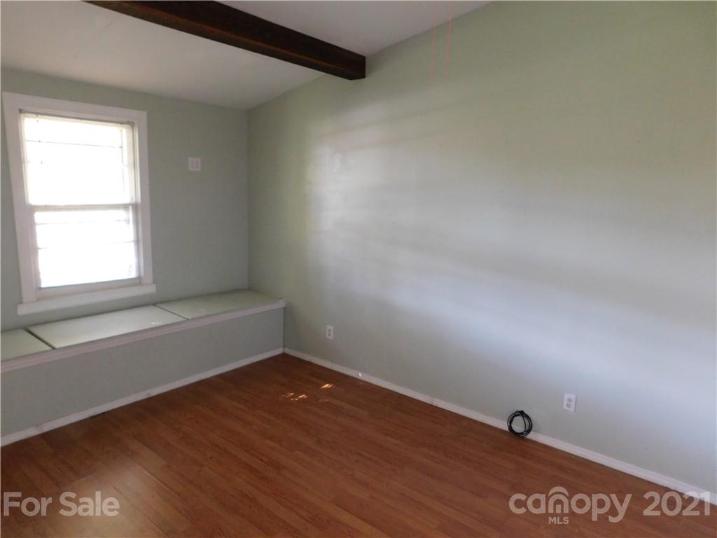 110 Blue Ridge Road Campobello, SC 29322 - Photo 14 of 26 an empty room with wooden floor and windows